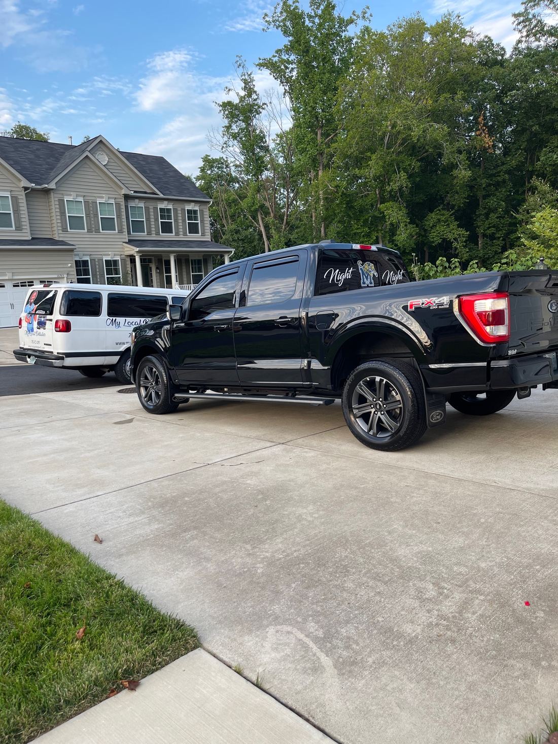 Pickup truck getting a hand wash and wheel cleaning in a Northern Virginia driveway.