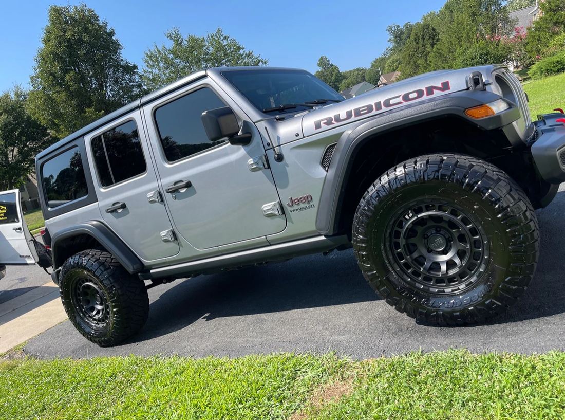 Off-road tire and wheel detail on a lifted Jeep.