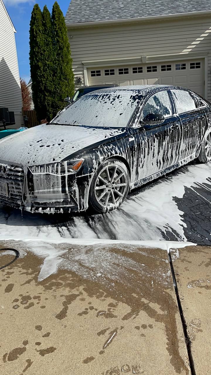 Rolls-Royce getting a gentle hand wash and foam bath.
