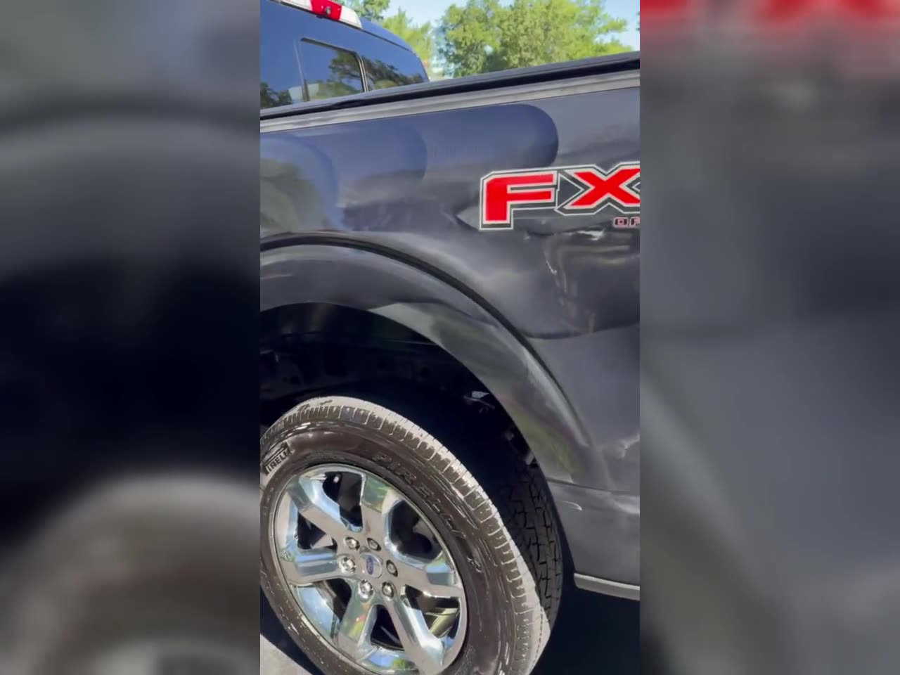 Wheel and fender detail on a Ford F-150 FX4, finished with a deep, glossy shine.