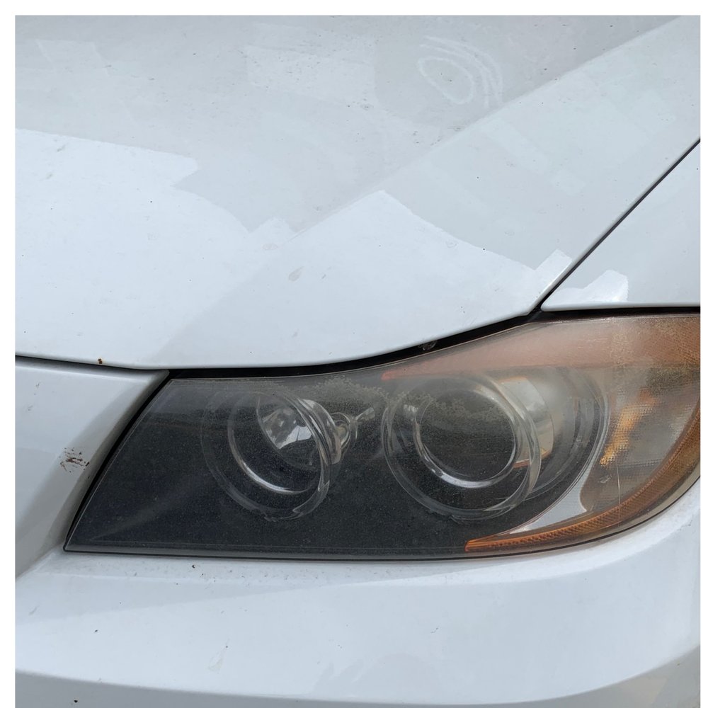Headlight after restoration, showing clear, restored lens