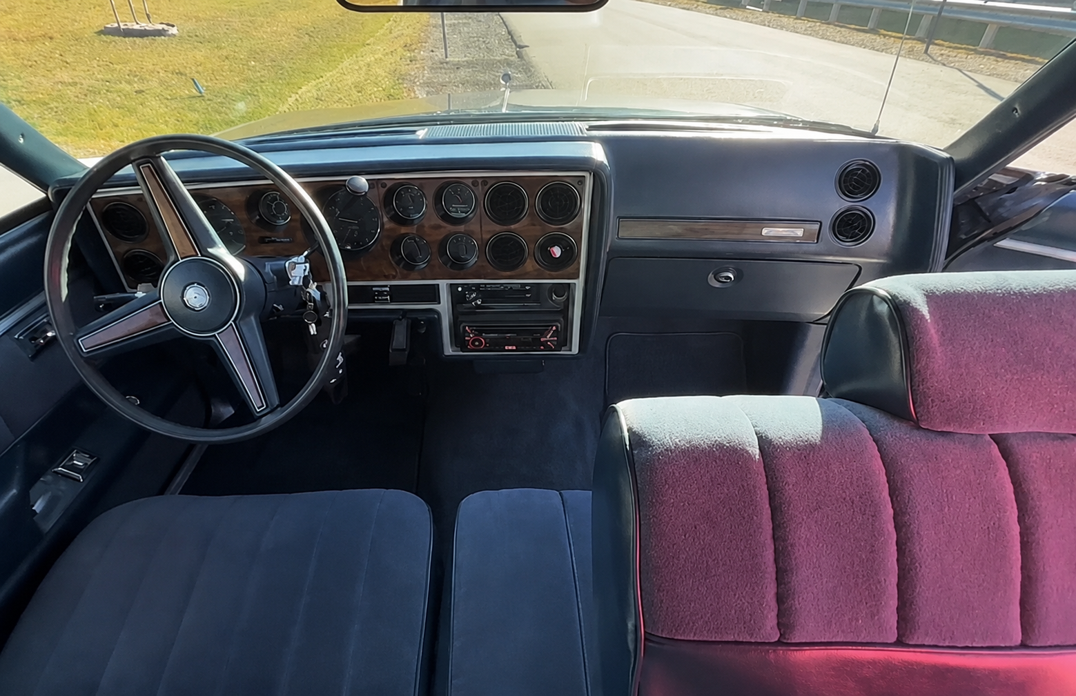 Interior detailing on a classic Oldsmobile Cutlass with upholstery restoration.